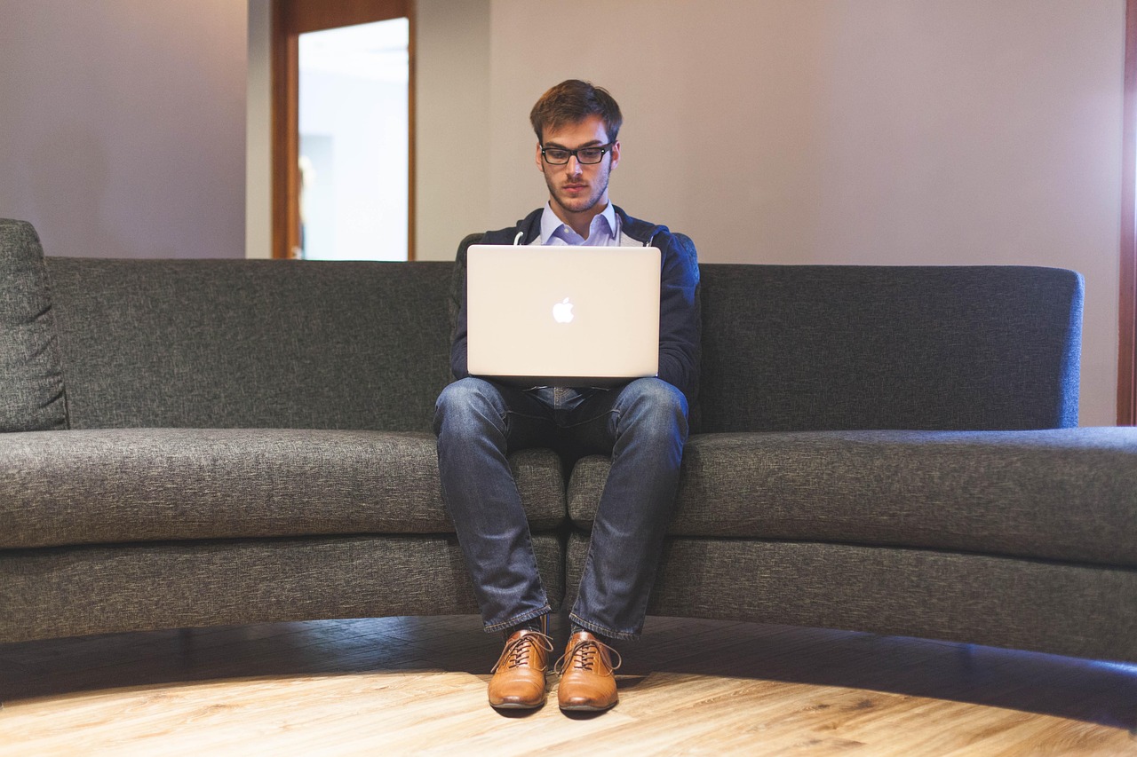 Man, laptop, businessman — Squatter Rights vs. Landlord Rights in NYC: Who Wins?